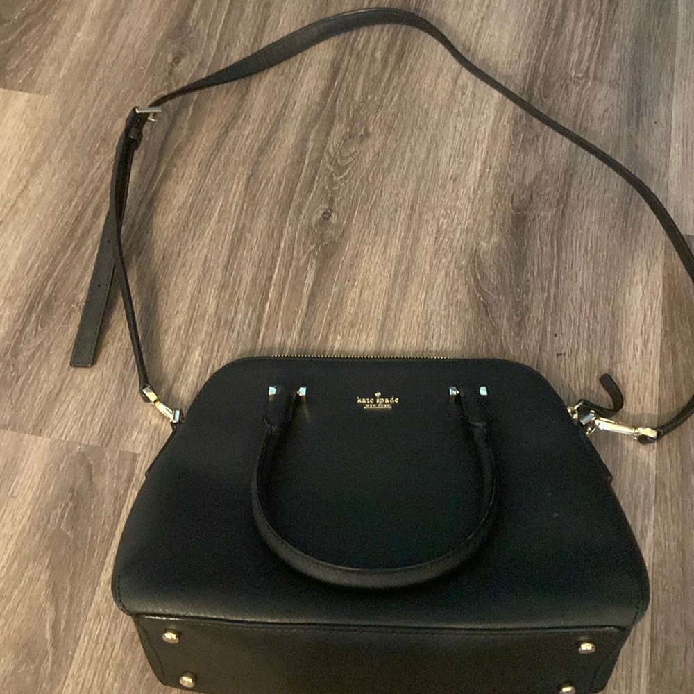 Medium Kate Spade purse, like new. Bag measures 12”x9”x4”